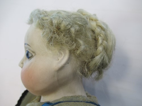 Lot 38 - A Victorian porcelain head doll, with blond...