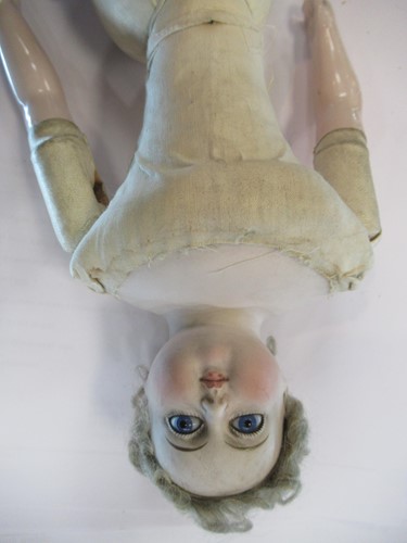Lot 38 - A Victorian porcelain head doll, with blond...
