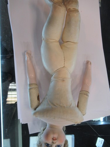 Lot 38 - A Victorian porcelain head doll, with blond...
