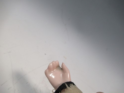 Lot 38 - A Victorian porcelain head doll, with blond...