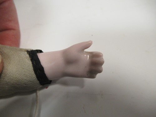 Lot 38 - A Victorian porcelain head doll, with blond...