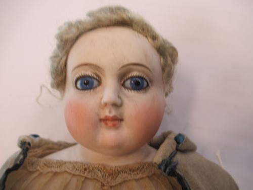 Lot 38 - A Victorian porcelain head doll, with blond...