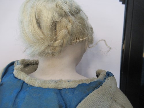 Lot 38 - A Victorian porcelain head doll, with blond...
