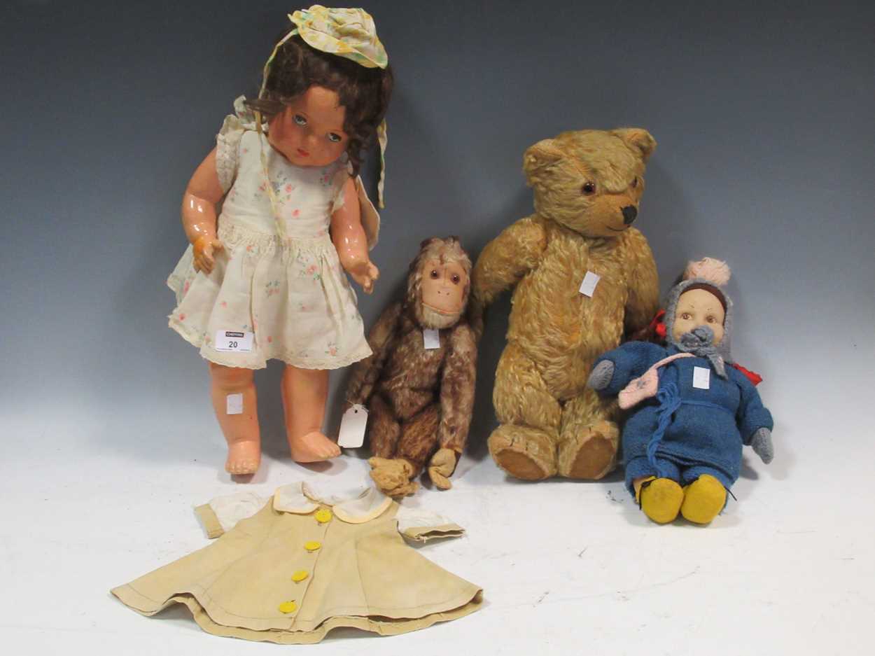 Lot 20 - A teddy bear, felt head doll, stuffed toy...