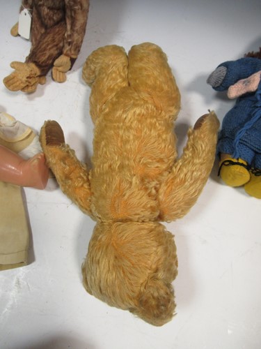 Lot 20 - A teddy bear, felt head doll, stuffed toy...
