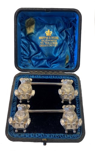 Lot 443 - A cased pair of early 20th century silver novelty knife rests