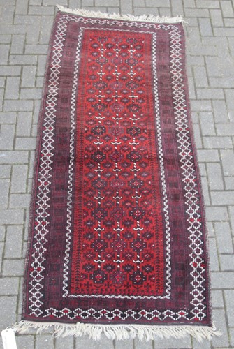 Lot 729 - A Beluchi runner 223 x 101cm