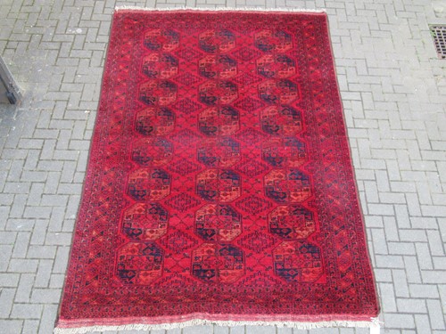 Lot 718 - An antique Afghan elephant's foot carpet 202 x...