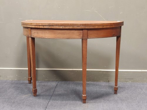 Lot 551 - An early 19th century walnut card table on...
