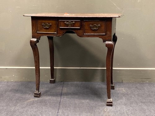 Lot 550 - An 18th century walnut lowboy with three short...