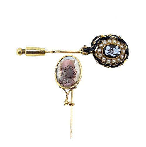 Lot 67 - An enamelled mourning stick pin, together with a cameo stick pin