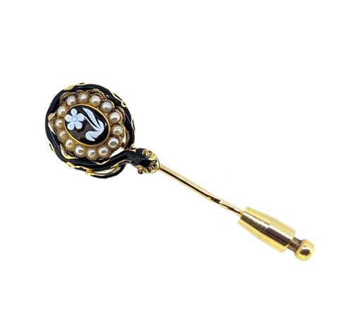 Lot 80 - An enamelled mourning stick pin, together with a cameo stick pin