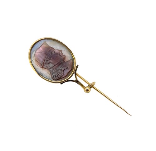 Lot 80 - An enamelled mourning stick pin, together with a cameo stick pin