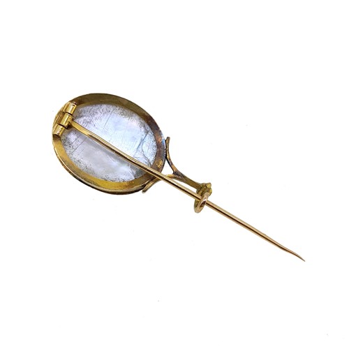 Lot 80 - An enamelled mourning stick pin, together with a cameo stick pin