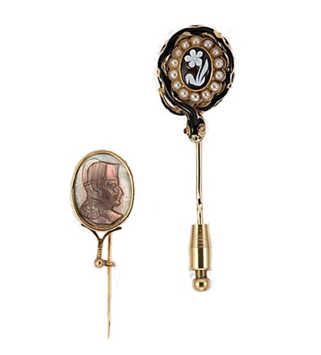 Lot 80 - An enamelled mourning stick pin, together with a cameo stick pin