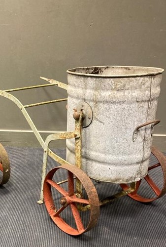 Lot 698 - A galvanised water bowser on cast iron carriage