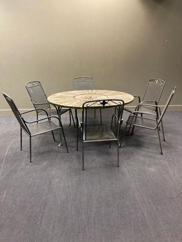 Lot 702 - A large circular garden table, with wrought...