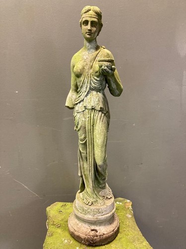 Lot 707 - A reconstituted stone garden statue of Hebe,...