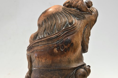 Lot 160 - A Chinese bamboo carving of Liu Hai and the greedy toad, Qing Dynasty, 19th century