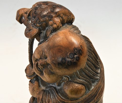 Lot 160 - A Chinese bamboo carving of Liu Hai and the greedy toad, Qing Dynasty, 19th century