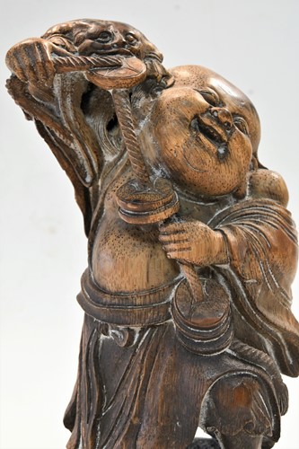 Lot 160 - A Chinese bamboo carving of Liu Hai and the greedy toad, Qing Dynasty, 19th century