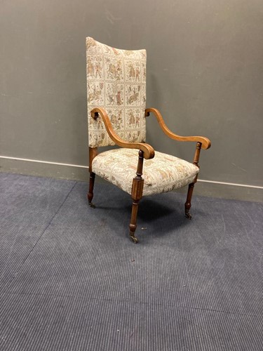 Lot 581 - A 19th century crossbanded high-back elbow chair