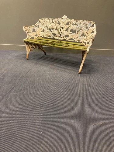 Lot 705 - A 19th century cast iron garden bench in...