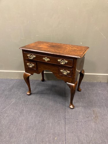 Lot 507 - An 18th century low boy with three drawers on...