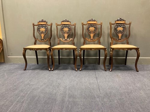Lot 501 - A set of four Edwardian mahogany chairs, the...