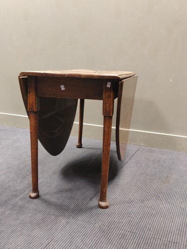 Lot 502 - An 18th century oak drop leaf table 72 x 161 x...