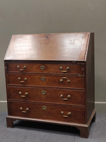 Lot 650 - A George III mahogany bureau the full front...