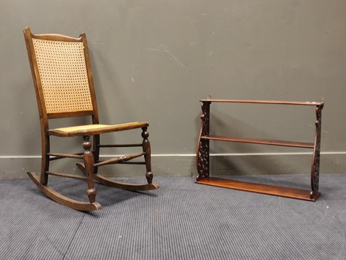 Lot 545 - An oak rocking chair with reeded splat and...