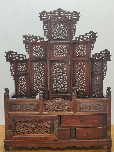 Lot 579 - A Chinese hardwood domestic shrine stand