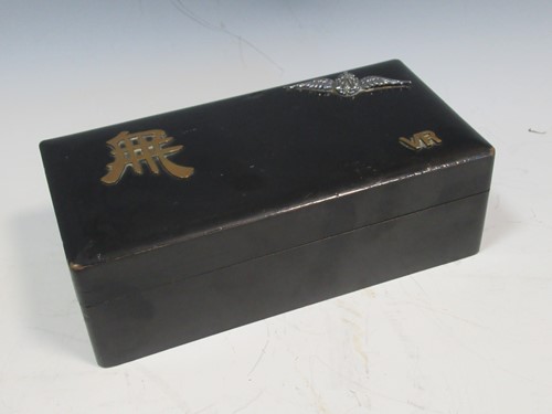Lot 28 - A black laquered box decorated with RAF badge...