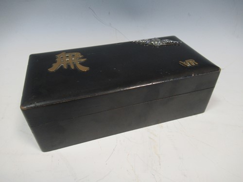 Lot 28 - A black laquered box decorated with RAF badge...