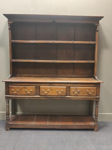 Lot 595 - An oak dresser in the 18th century style, 179...