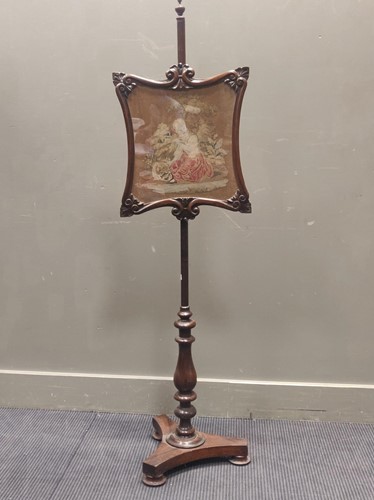 Lot 544 - A Victorian mahogany and rosewood pole screen,...