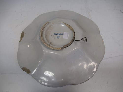 Lot 35 - A 19th century Delft plate decorated with...