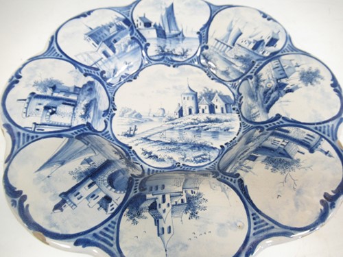 Lot 35 - A 19th century Delft plate decorated with...