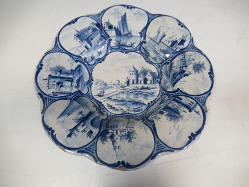 Lot 35 - A 19th century Delft plate decorated with...