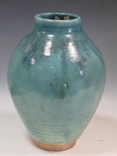 Lot 25 - An impressive green glaze ovoid vase decorated...