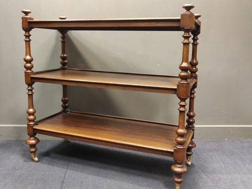 Lot 494 - A 19th century oak three tier buffet with...