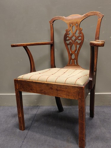 Lot 569 - A country made George III elbow chair with...