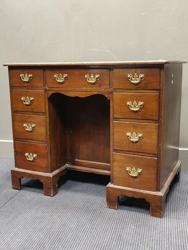 Lot 552 - A George III style mahogany kneehole desk 74 x...