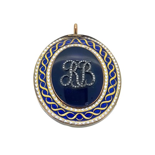 Lot 68 - An enamel and diamond memorial pendant with monogram