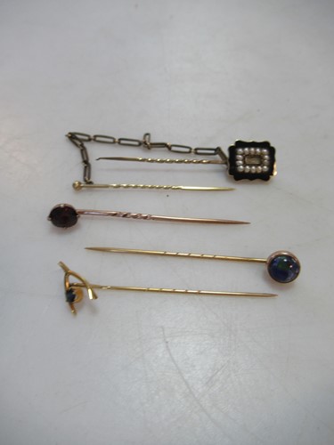 Lot 236 - A memorial hat pin tested as 9ct gold, a...
