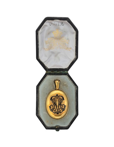 Lot 74 - An enamelled memorial locket