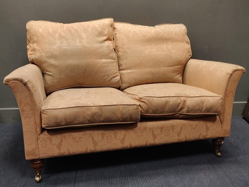 Lot 539 - A modern two seater sofa with fire regulations,...