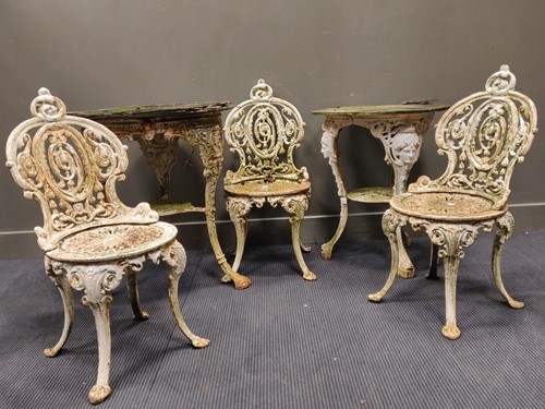 Lot 690 - Two painted cast iron garden tables and three...