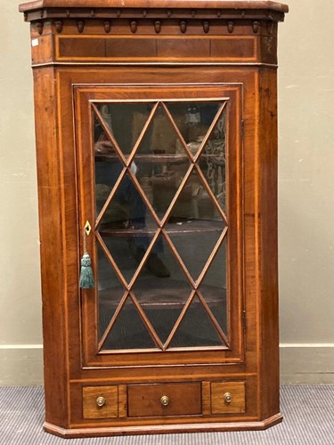 Lot 640 - A 19th century inlaid mahogany corner cabinet...